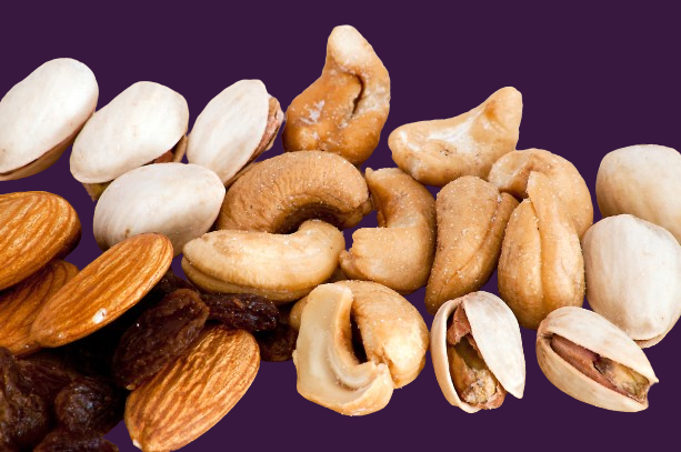 assorted nuts and raisins on a purple background