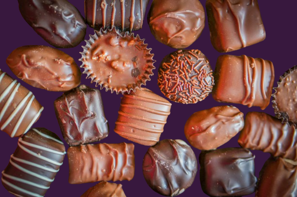 assorted chocolates on a purple background
